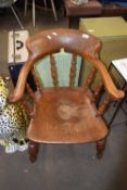 A Victorian elm seated bow back captains type chair
