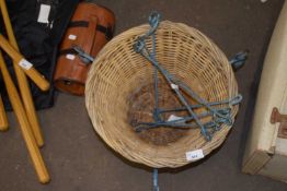 A wicker basket and metal hangers