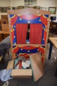 A Punch & Judy stand together with various puppets