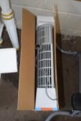 A boxed Delonghi electric heater