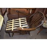 An Ercol chair frame and accompanying footstool