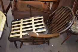 An Ercol chair frame and accompanying footstool