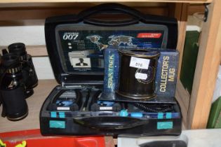 A James Bond 007 walkie talkie set together with a Star Trek collectors mug