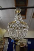A 20th Century ceiling light fitting with hanging glass drapes
