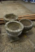 Mixed lot of planters to include a pair of urns plus one other