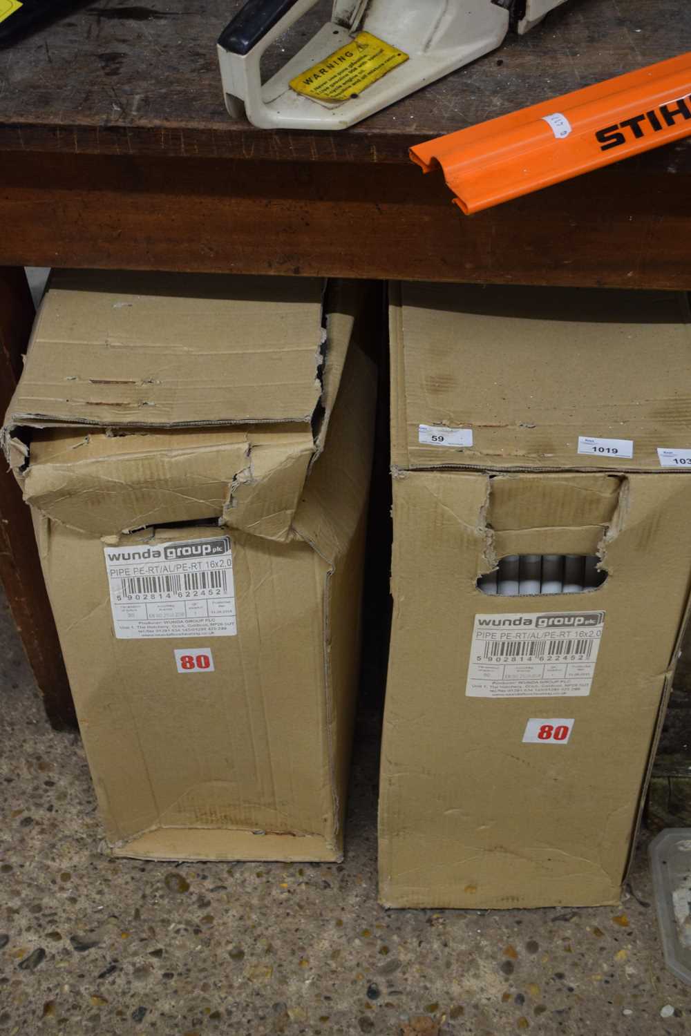 Two boxes of PVC piping