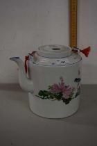An Oriental porcelain tea kettle with floral decoration