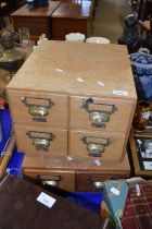 Two wooden office card filing cabinets