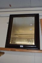 Rectangular bevelled mirror in an ebonised frame