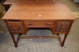 A 20th Century oak desk or dressing table with linen fold carving, 107cm wide