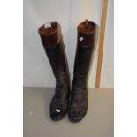 A pair of vintage leather riding boots