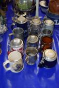 A collection of modern beer steins, pewter tankards etc