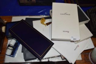 A collection of various Concorde related gift wares to include paperweight, notebook, document