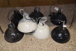 Group of seven industrial style pendant light fittings