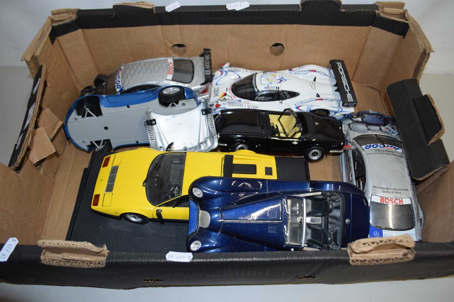 A collection of Maisto and other model cars