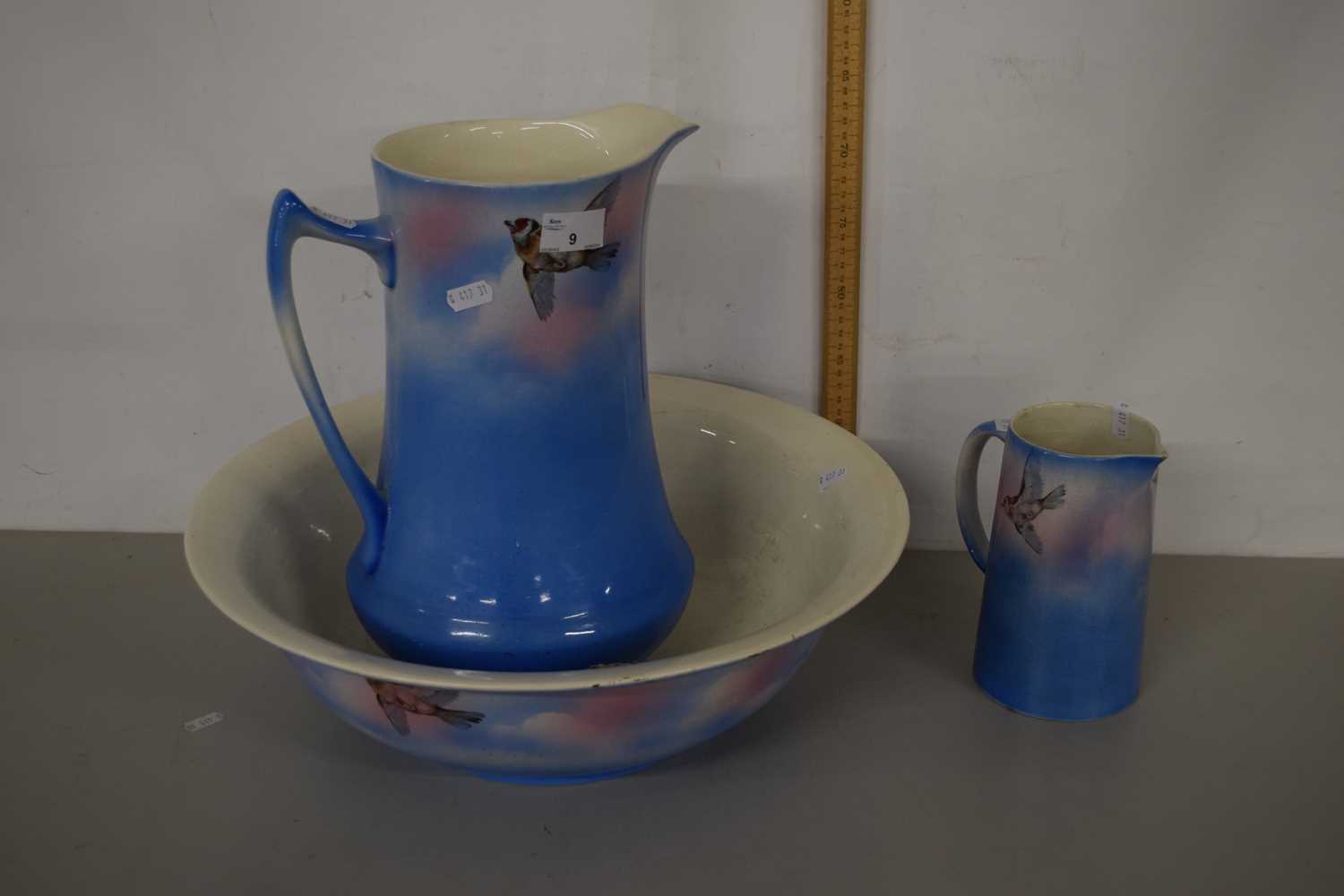 A wash jug, bowl and further small jug, patterned with birds