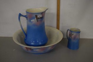 A wash jug, bowl and further small jug, patterned with birds