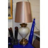 A large modern table lamp with tapering shade