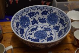 A reproduction Chinese blue and white punch bowl