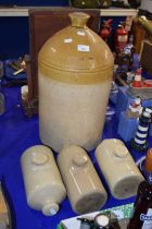 A large unbranded stone ware flagon and three stone ware hot water bottles (4)