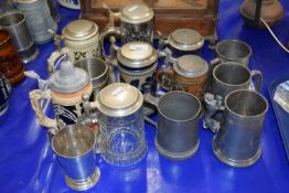 A collection of modern beer steins, pewtern tankards etc