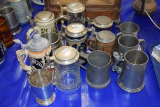 A collection of modern beer steins, pewtern tankards etc