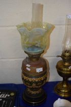 Ceramic based oil lamp with vaseline glass shade