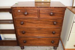 A Victorian mahogany five drawer chest on turned legs