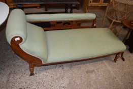 A late Victorian pale green upholstered chaise longue