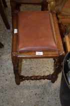 An oak framed footstool