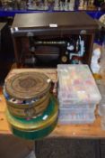 Vintage Singer sewing machine together with boxes of various sewing supplies