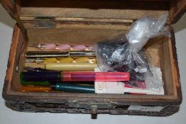 Small carved box of various assorted fountain pens and other items