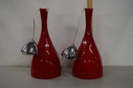 A pair of modern glass pendant light fittings