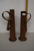 Two similar narrow copper jugs