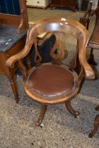 A late 19th or early 20th Century bow back revolving desk chair