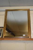Modern wall mirror in gilt finish frame