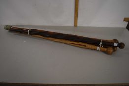 A group of four Knobkerrie type walking sticks
