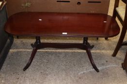 A mahogany veneered twin pedestal coffee table