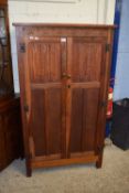 A small oak wardrobe or cupboard with carved linen fold decoration