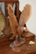A contemporary carved wooden model of an Eagle, 62cm high