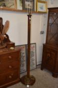A 20th Century Oriental hardwood standard lamp with carved decoration