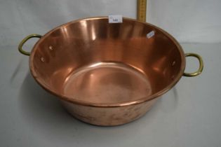 A circular copper pan