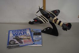Contemporary model of a Spitfire together with Images of War magazine