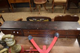 A small 19th Century six drawer cabinet, probably part of a larger piece, 94cm wide