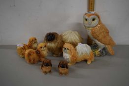 A Beswick model of a barn owl together with a range off model Pekingese dogs