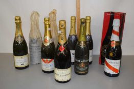 A group of various bottles of Champagne to include Moet & Chandon, Mumm & Co and various others (