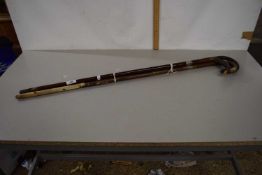 Group of four silver banded walking canes