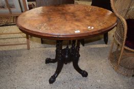 A Victorian walnut veneered centre table with oval top and four outswept legs, 90cm wide