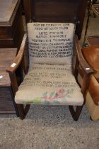 An oak framed armchair with coffee sack upholstery