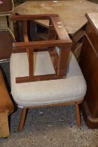 An ercol footstool together with a further small oak framed footstool